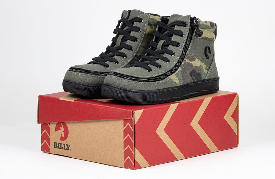 Kid's Olive Camo BILLY Street High Tops, zipper shoes, like velcro, that are adaptive, accessible, inclusive and use universal design to accommodate an afo. BILLY Footwear comes in medium and wide width, M, D and EEE, are comfortable, and come in toddler, kids, mens, and womens sizing.