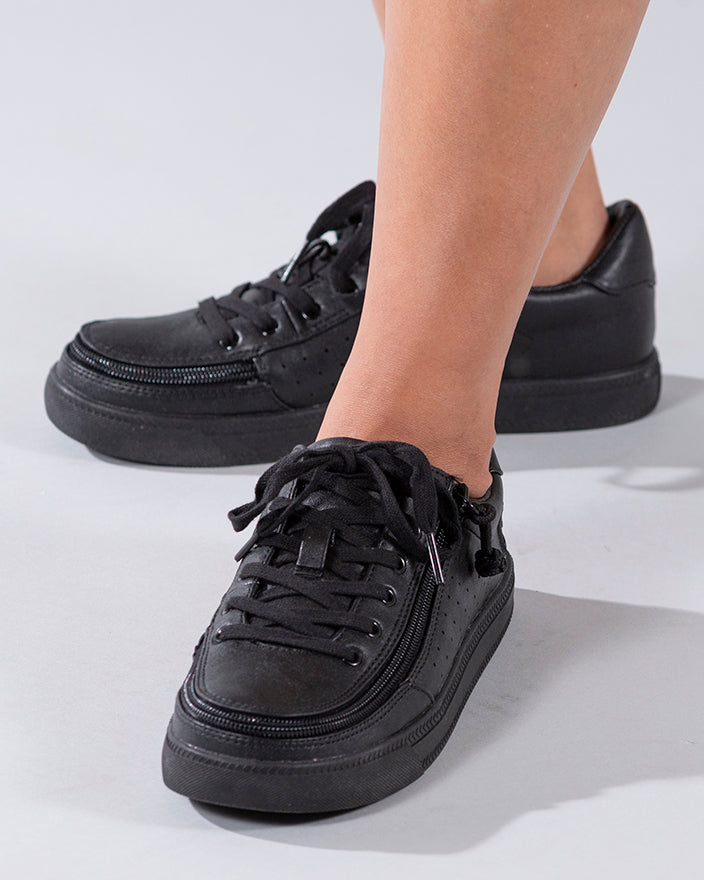 Women's Black to the Floor Faux Leather BILLY Low Sneakers, zipper shoes, like velcro, that are adaptive, accessible, inclusive and use universal design to accommodate an afo. Footwear is medium and wide width, M, D and EEE, are comfortable, and come in toddler, kids, mens, and womens sizing.