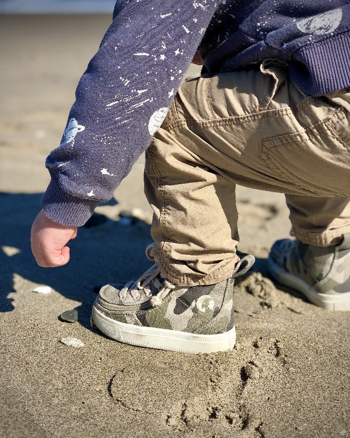 Toddler Natural Camo BILLY Classic Lace Highs, zipper shoes, like velcro, that are adaptive, accessible, inclusive and use universal design to accommodate an afo. Footwear is medium and wide width, M, D and EEE, are comfortable, and come in toddler, kids, mens, and womens sizing.
