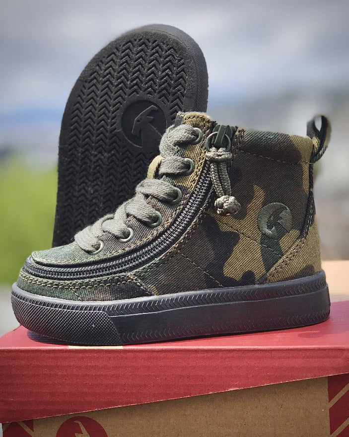 Toddler Green Camo BILLY Classic Lace Highs, zipper shoes, like velcro, that are adaptive, accessible, inclusive and use universal design to accommodate an afo. Footwear is medium and wide width, M, D and EEE, are comfortable, and come in toddler, kids, mens, and womens sizing.